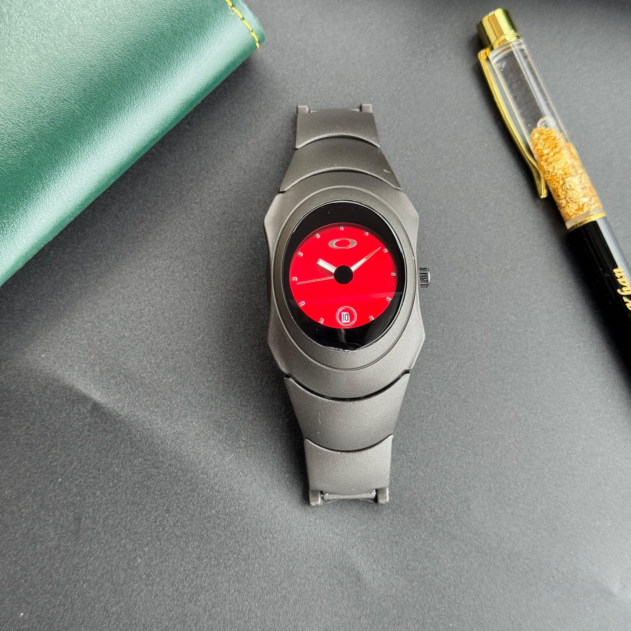 Oakley Time Bomb Red Dial – Futuristic Matte Titanium Watch