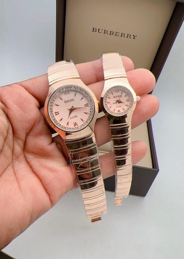 Rado watches, both with a rose gold finish and pink dials.