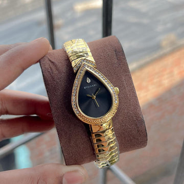 Bvlgari ladies watch featuring a unique teardrop-shaped green dial with