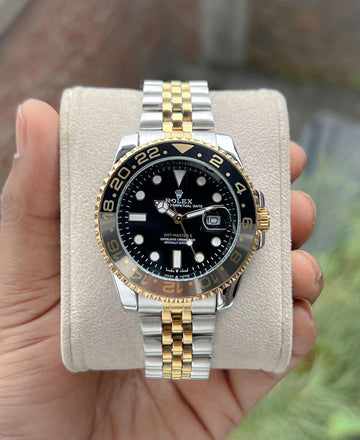 Rolex GMT-Master II watch with an Oystersteel and yellow gold bracelet and a black dial.